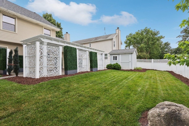 584 Beaconsfield Ave, Naperville, IL 60565 - back of house featuring a storage shed and a chimney