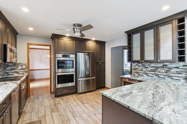 584 Beaconsfield Ave, Naperville, IL 60565 - kitchen with stainless steel appliances, ceiling fan, light wood-style flooring, light stone counters, and dark brown cabinetry