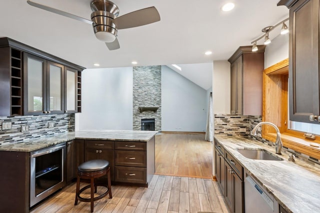 584 Beaconsfield Ave, Naperville, IL 60565 - kitchen featuring wine cooler, ceiling fan, light wood-style floors, dishwashing machine, and light stone countertops