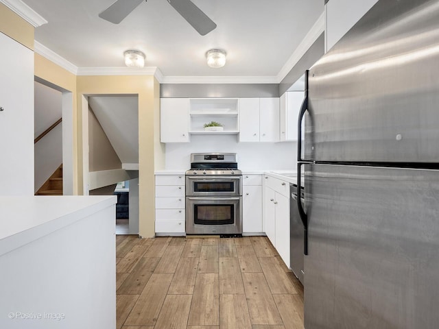 0S544 E St, Winfield, IL 60190 - kitchen with stainless steel appliances, ornamental molding, light wood-style floors, a ceiling fan, and white cabinetry
