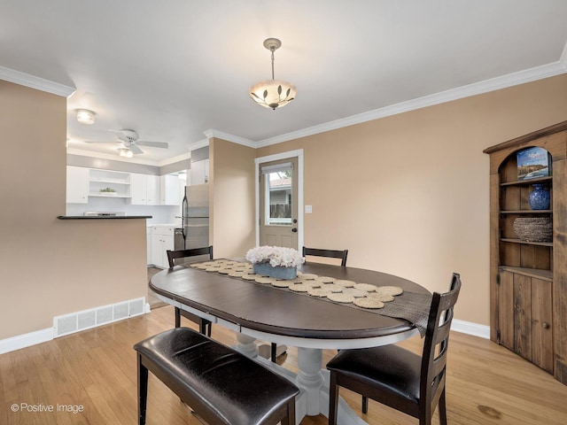 0S544 E St, Winfield, IL 60190 - dining area featuring light wood-style flooring, crown molding, and ceiling fan