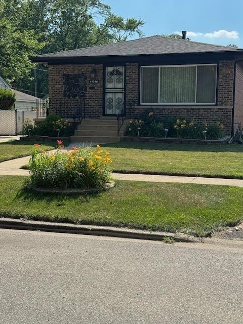 14240 S Manistee Ave, Burnham, IL 60633 - view of front of home with brick siding and a front yard