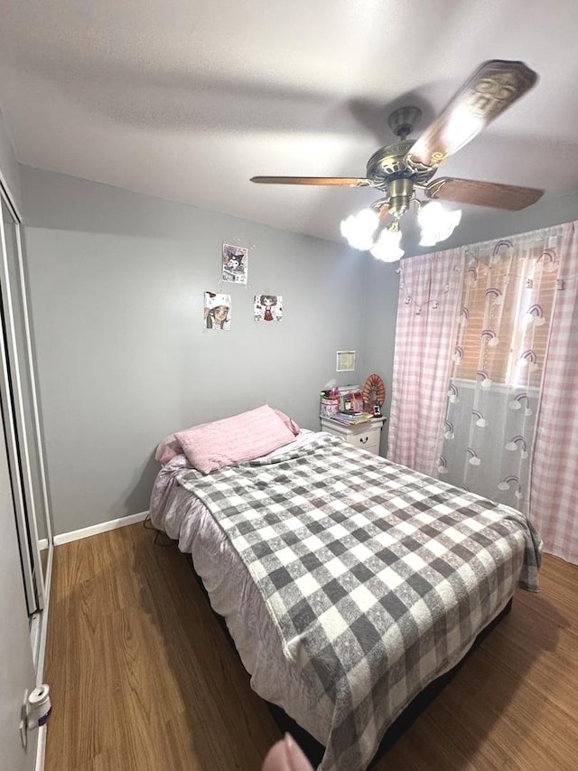 14240 S Manistee Ave, Burnham, IL 60633 - bedroom with wood finished floors, a ceiling fan, and a closet