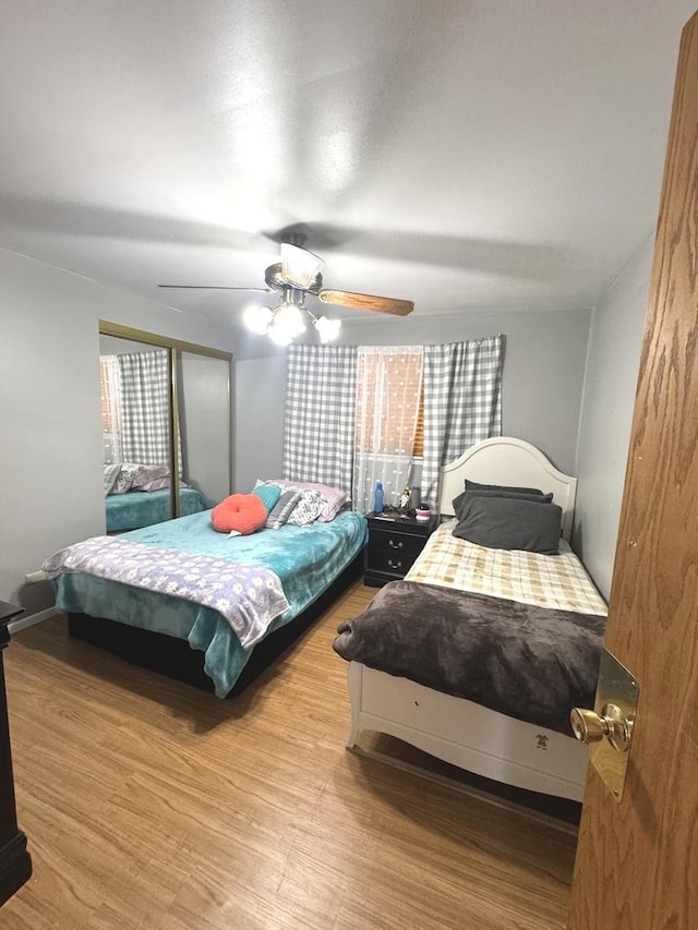14240 S Manistee Ave, Burnham, IL 60633 - bedroom with wood finished floors and ceiling fan