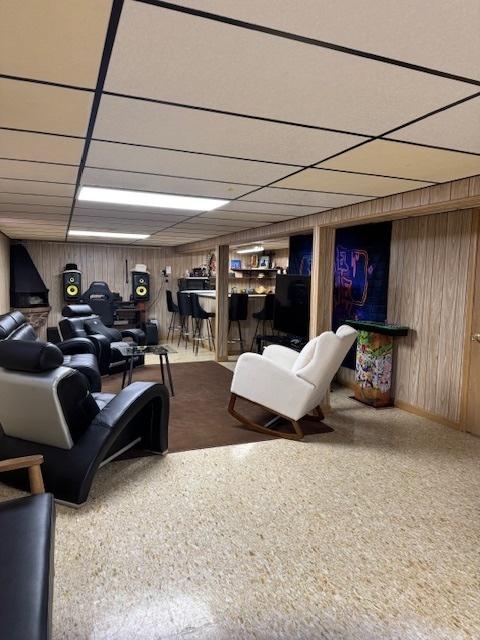 14240 S Manistee Ave, Burnham, IL 60633 - below grade area with carpet flooring, wooden walls, and a paneled ceiling