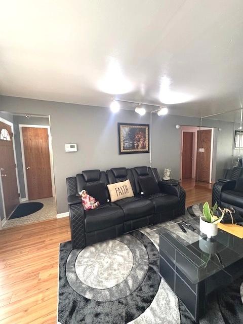 14240 S Manistee Ave, Burnham, IL 60633 - living room featuring light wood-type flooring and baseboards