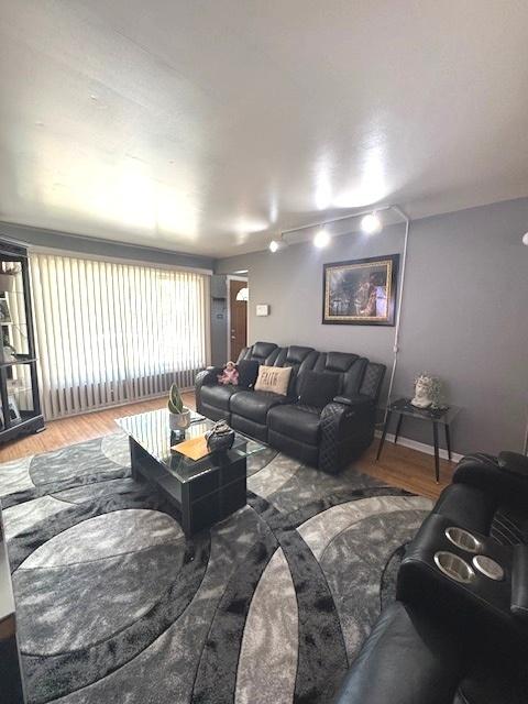 14240 S Manistee Ave, Burnham, IL 60633 - living area with wood finished floors and baseboards