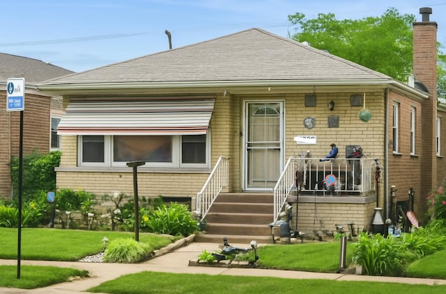 4732 S Lamon Ave, Chicago, IL 60638 - back of house featuring a yard, brick siding, and a chimney