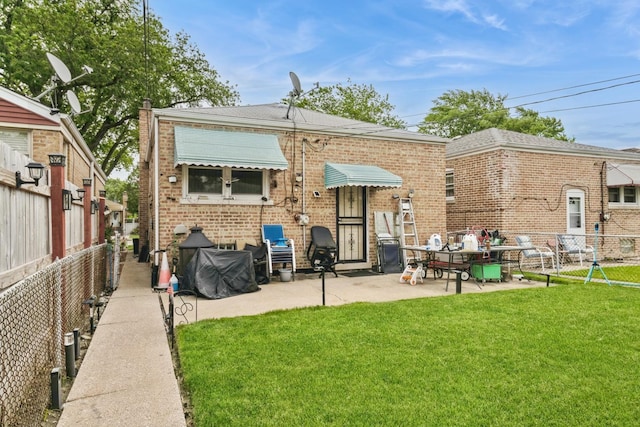 4732 S Lamon Ave, Chicago, IL 60638 - back of property featuring brick siding, a fenced backyard, and a patio