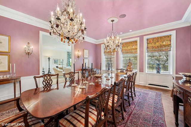 1500 N Lake Shore Dr Unit 5B, Chicago, IL 60610 - dining room featuring a chandelier, ornamental molding, plenty of natural light, and a wainscoted wall