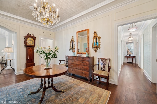 1500 N Lake Shore Dr Unit 5B, Chicago, IL 60610 - corridor featuring ornamental molding, dark wood-style floors, a chandelier, and a decorative wall