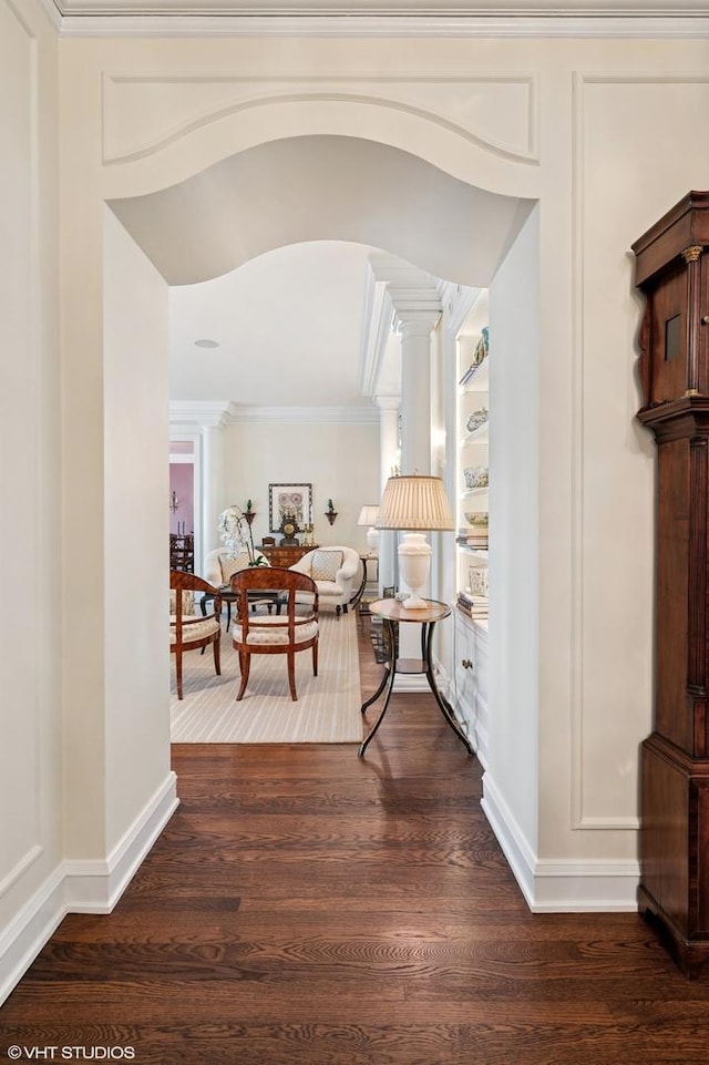 1500 N Lake Shore Dr Unit 5B, Chicago, IL 60610 - hallway with decorative columns, crown molding, and dark wood-style flooring