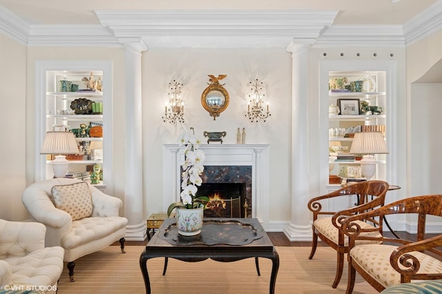 1500 N Lake Shore Dr Unit 5B, Chicago, IL 60610 - sitting room with crown molding, ornate columns, wood finished floors, and a premium fireplace