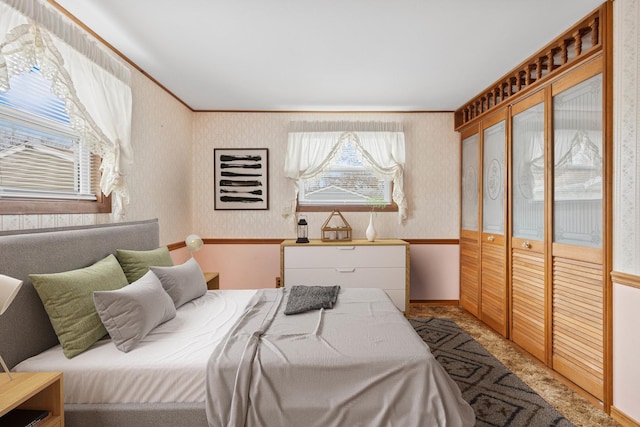 120 Madera Cir, Carpentersville, IL 60110 - bedroom featuring wallpapered walls, crown molding, and a closet