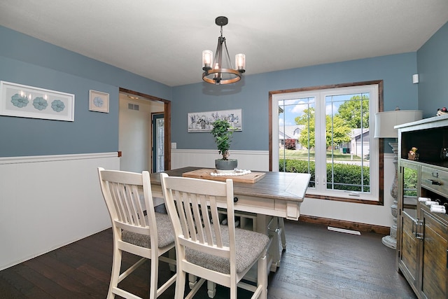 1553 Noble Quest Dr, Bourbonnais, IL 60914 - dining space with dark wood-type flooring, a chandelier, and wainscoting