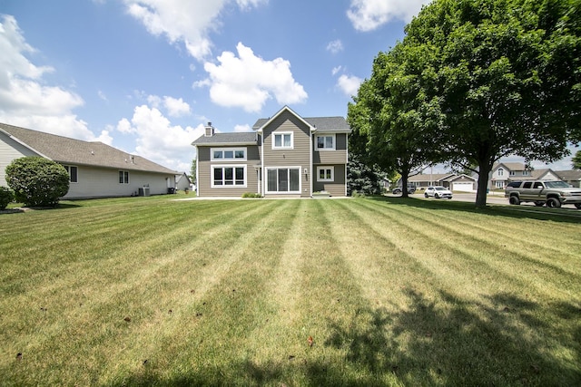 1553 Noble Quest Dr, Bourbonnais, IL 60914 - rear view of property with a yard and a chimney