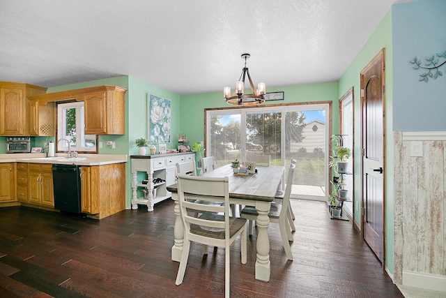 1553 Noble Quest Dr, Bourbonnais, IL 60914 - dining space featuring a chandelier, dark wood finished floors, and a textured ceiling