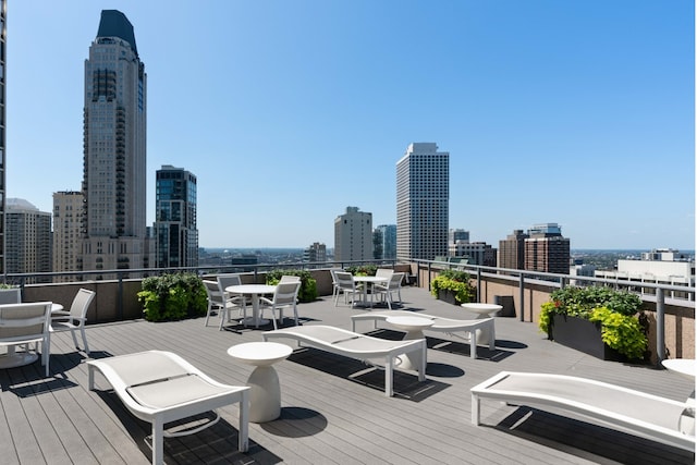 950 N Michigan Ave Unit 4306, Chicago, IL 60611 - wooden terrace featuring outdoor dining space and a skyline view