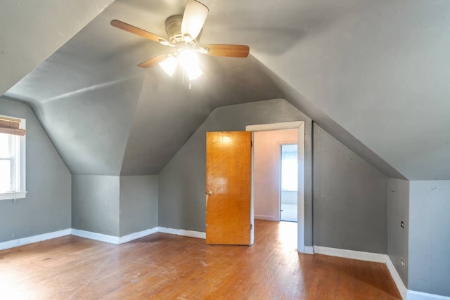 1710 N 74th Ct, Elmwood Park, IL 60707 - bonus room featuring hardwood / wood-style flooring, vaulted ceiling, ceiling fan, and healthy amount of natural light