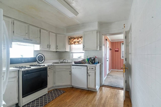 1710 N 74th Ct, Elmwood Park, IL 60707 - kitchen featuring white appliances, under cabinet range hood, light countertops, light wood-style flooring, and white cabinets