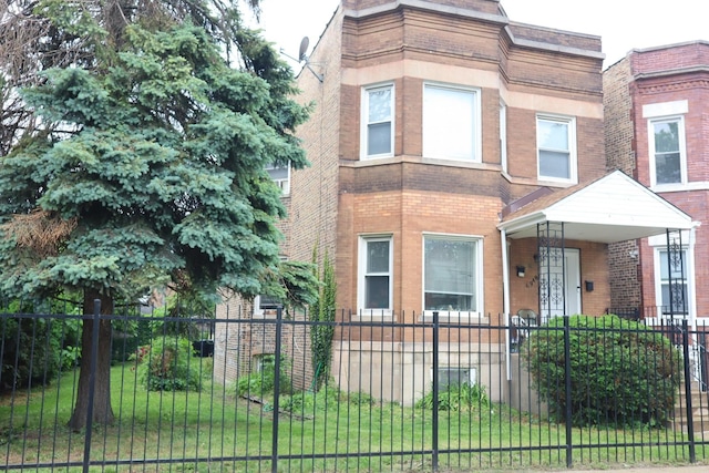 6948 S Eberhart Ave, Chicago, IL 60637 - view of front of property with brick siding and a fenced front yard