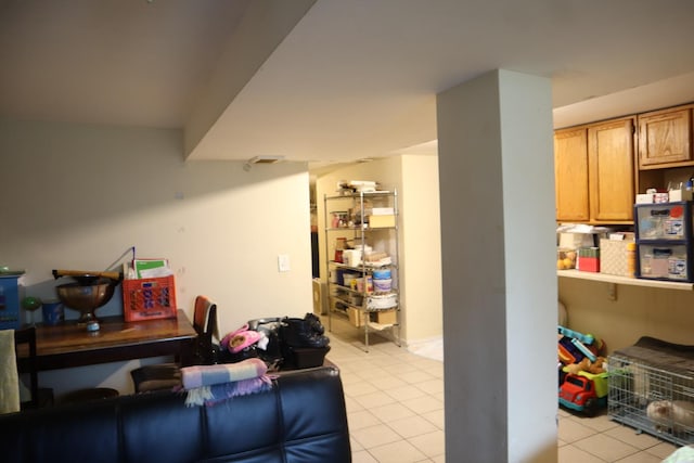 6948 S Eberhart Ave, Chicago, IL 60637 - below grade area featuring light tile patterned flooring