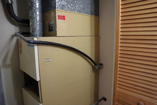 4829 W 109th St Unit 203, Oak Lawn, IL 60453 - utility room featuring radiator and heating unit