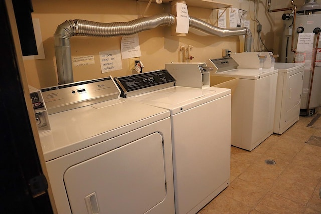 4829 W 109th St Unit 203, Oak Lawn, IL 60453 - laundry room featuring independent washer and dryer, water heater, and light tile patterned floors