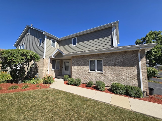 8452 Dunmore Dr, Tinley Park, IL 60487 - view of front of house featuring brick siding and a front yard