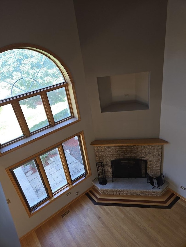 8452 Dunmore Dr, Tinley Park, IL 60487 - detailed view of a brick fireplace and wood finished floors