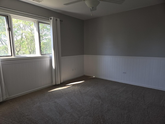 8452 Dunmore Dr, Tinley Park, IL 60487 - empty room featuring a ceiling fan, a wainscoted wall, and carpet flooring