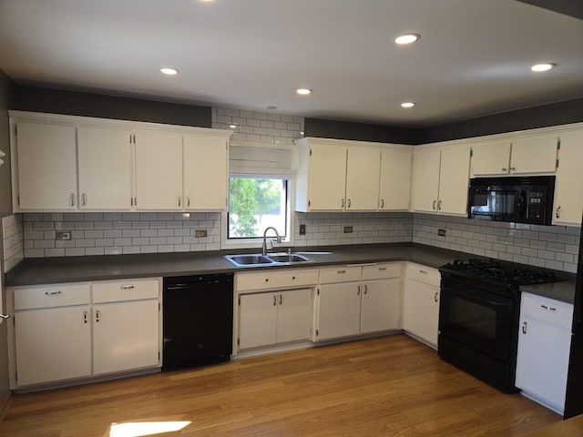 8452 Dunmore Dr, Tinley Park, IL 60487 - kitchen with black appliances, dark countertops, white cabinets, decorative backsplash, and recessed lighting