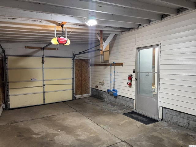 1700 Sycamore, Quincy, IL 62301 - garage featuring a garage door opener and wooden walls