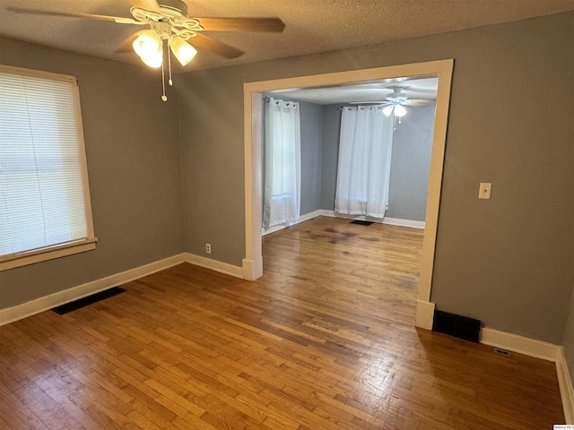 1700 Sycamore, Quincy, IL 62301 - spare room with ceiling fan and wood finished floors
