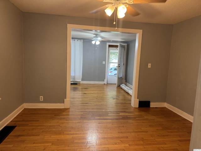 1700 Sycamore, Quincy, IL 62301 - spare room with ceiling fan and hardwood / wood-style floors
