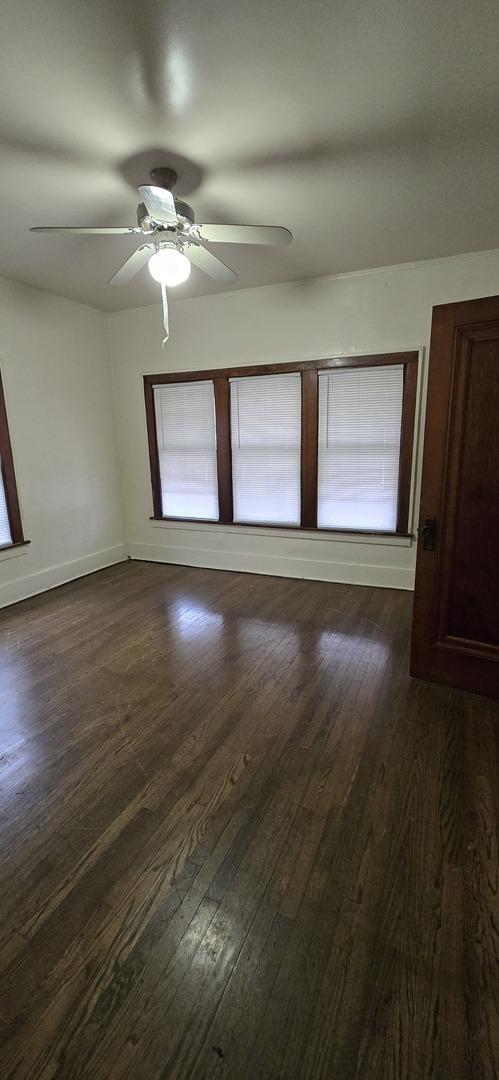83 W 15th St, Chicago Heights, IL 60411 - unfurnished room with a ceiling fan and dark wood finished floors