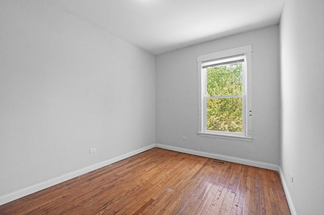 6409 S Champlain Ave, Chicago, IL 60637 - empty room with hardwood / wood-style flooring and baseboards