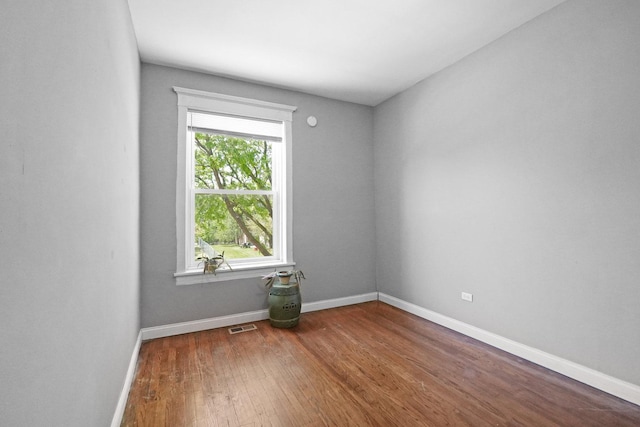 6409 S Champlain Ave, Chicago, IL 60637 - unfurnished room with wood finished floors and baseboards