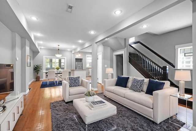 6409 S Champlain Ave, Chicago, IL 60637 - living area with light wood-type flooring, stairway, and recessed lighting