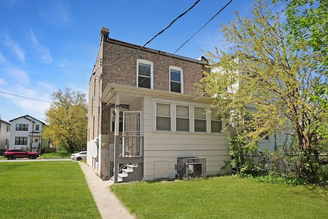 6409 S Champlain Ave, Chicago, IL 60637 - view of front of home featuring a front lawn and brick siding