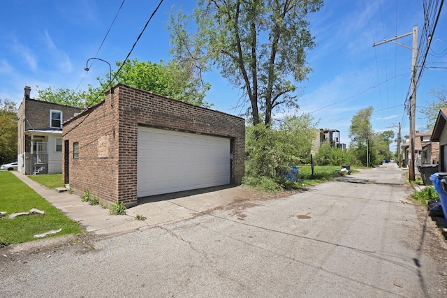 6409 S Champlain Ave, Chicago, IL 60637 - view of property exterior with brick siding and a detached garage