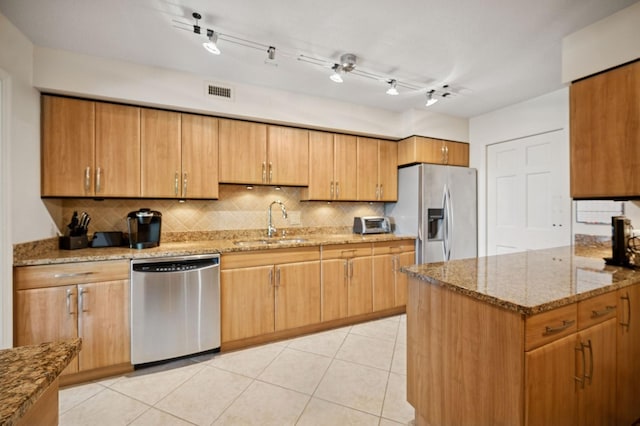 1671 Mission Hills Rd Unit 501, Northbrook, IL 60062 - kitchen with stainless steel appliances, tasteful backsplash, light stone countertops, and light tile patterned flooring