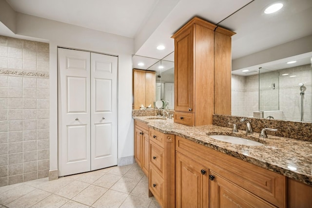 1671 Mission Hills Rd Unit 501, Northbrook, IL 60062 - full bath featuring tile patterned flooring, double vanity, tiled shower, recessed lighting, and a closet