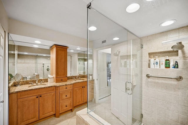 1671 Mission Hills Rd Unit 501, Northbrook, IL 60062 - bathroom with tile patterned floors, a stall shower, double vanity, and recessed lighting