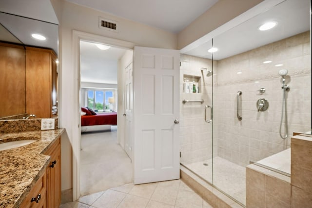 1671 Mission Hills Rd Unit 501, Northbrook, IL 60062 - ensuite bathroom featuring a stall shower, vanity, tile patterned floors, and recessed lighting