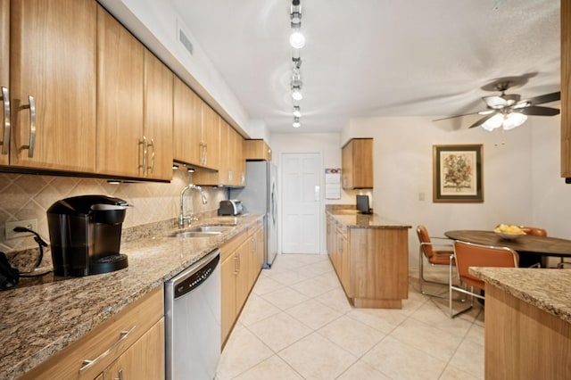 1671 Mission Hills Rd Unit 501, Northbrook, IL 60062 - kitchen with appliances with stainless steel finishes, ceiling fan, light stone counters, and light tile patterned floors