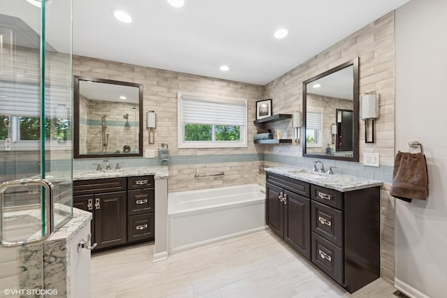 1885 Mcrae Ln, Mundelein, IL 60060 - bathroom featuring two vanities, a garden tub, a shower stall, and recessed lighting