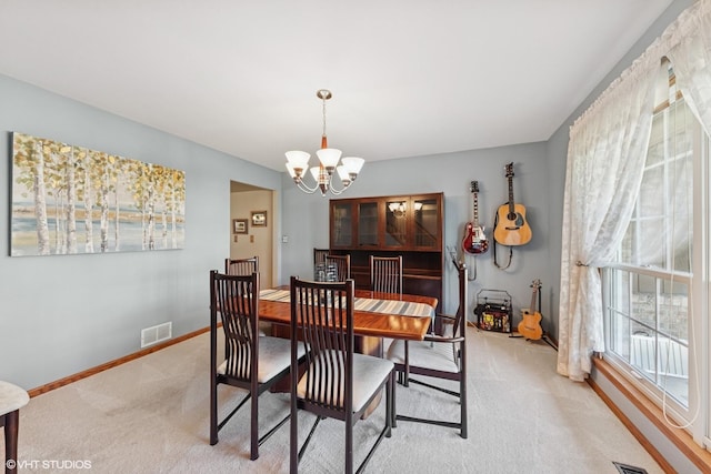 1885 Mcrae Ln, Mundelein, IL 60060 - dining area featuring a chandelier and light colored carpet