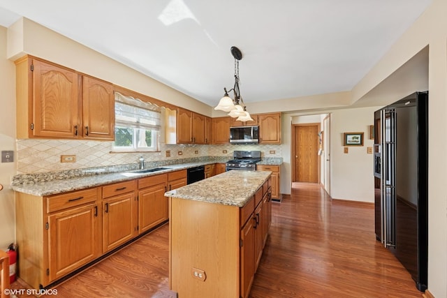 1885 Mcrae Ln, Mundelein, IL 60060 - kitchen featuring appliances with stainless steel finishes, a center island, wood finished floors, and backsplash