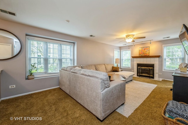 285 Sheffield Dr, Schaumburg, IL 60194 - living area featuring carpet floors, a ceiling fan, and a tiled fireplace